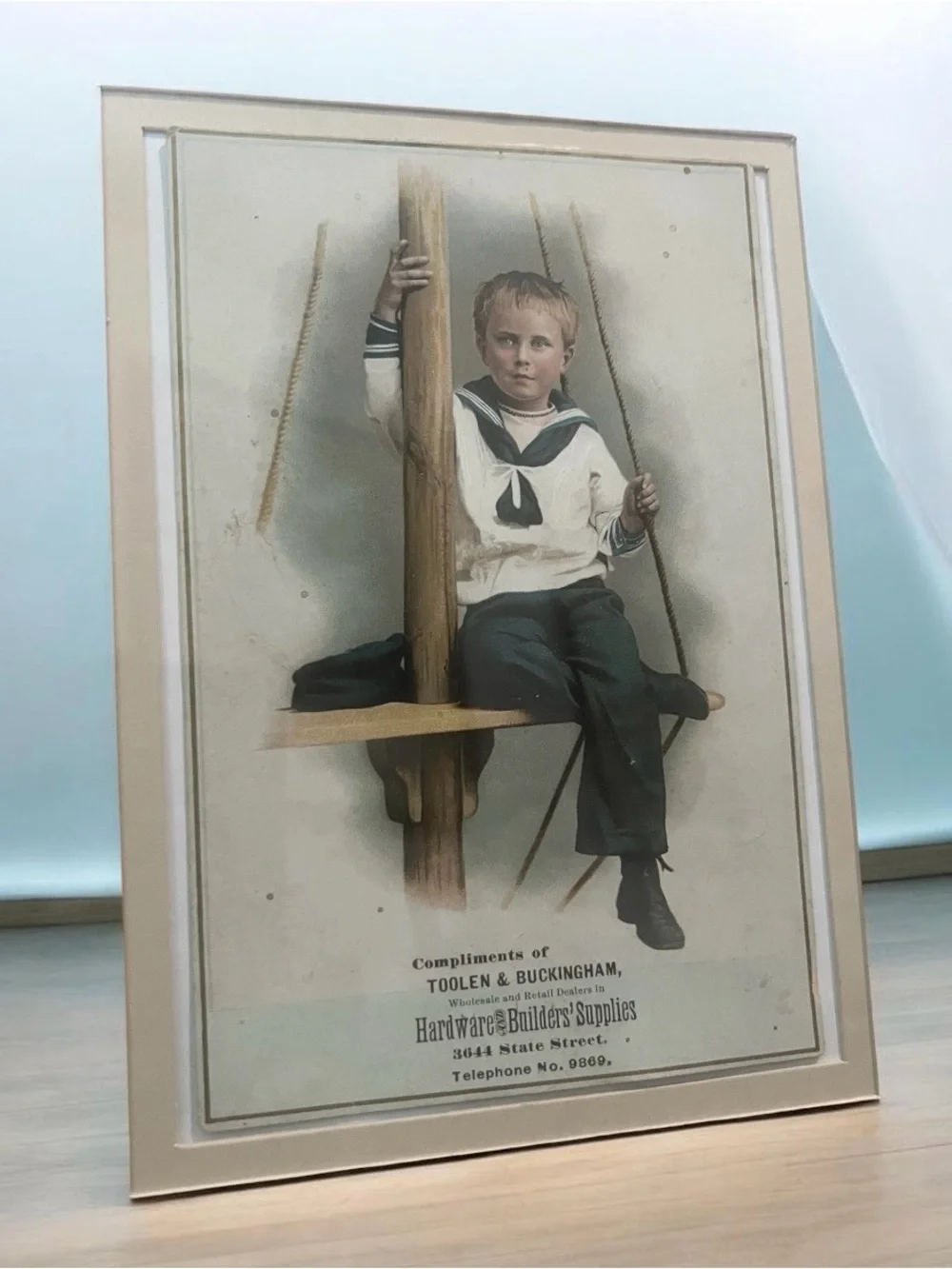 Vintage 1900, 1910 Hand-colored photograph of a boy sailor, a promotional item.